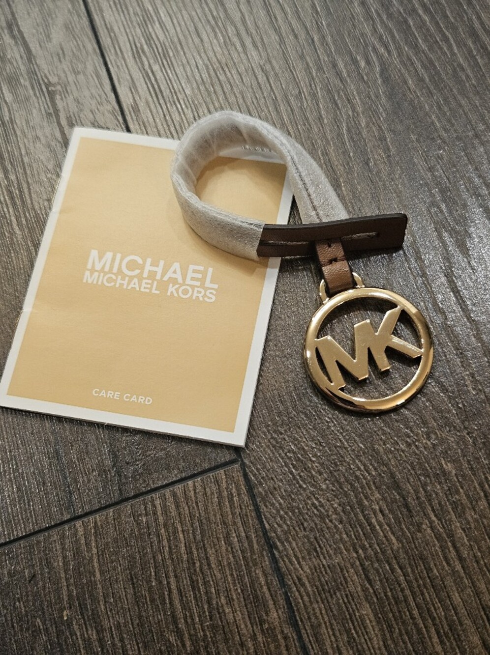 NEW Michael Kors Mercer MK Logo Leather Bag Charm Gold Brown